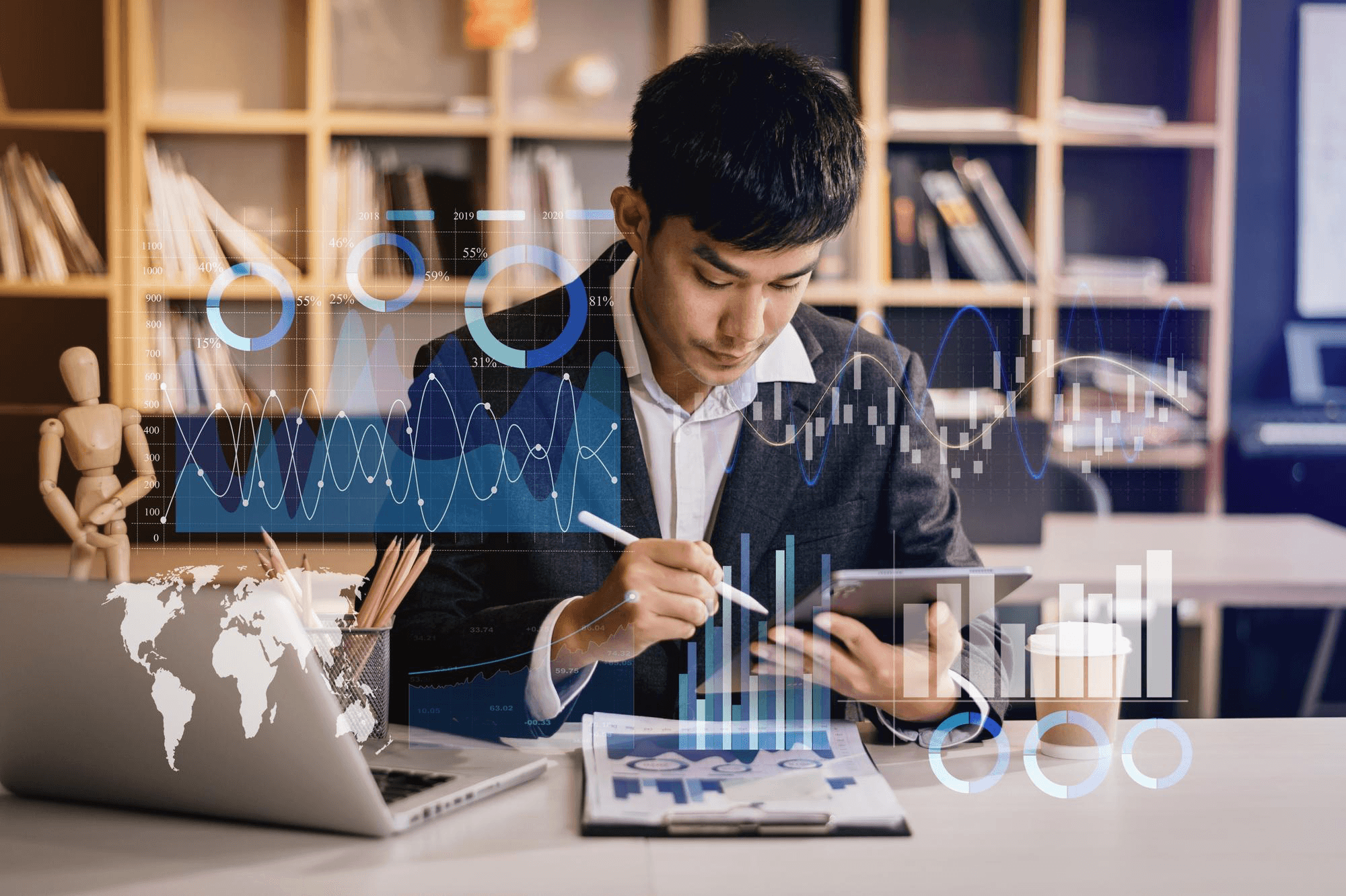 Young Asian man in suit analyzing data with digital graphics overlay