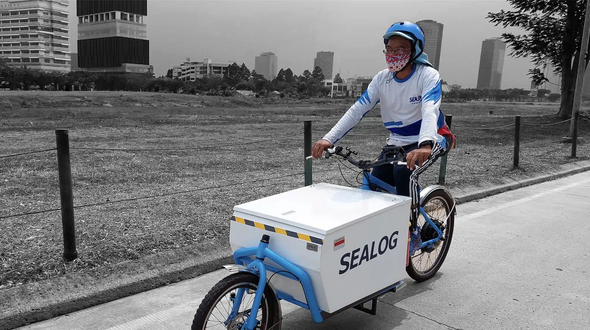 Sealog rider delivering packages to a local business, demonstrating eco-friendly practices in a sustainable supply chains.